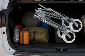 Collapsible Wagon Cart Canopy Seat stored inside the open trunk of a vehicle,
