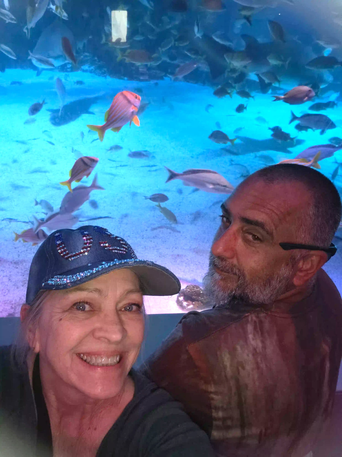 Expedia: Cincinnati Airport & KY Aquarium. We took a selfie beside aquarium tank, pet a stingray and laughed at the penguins